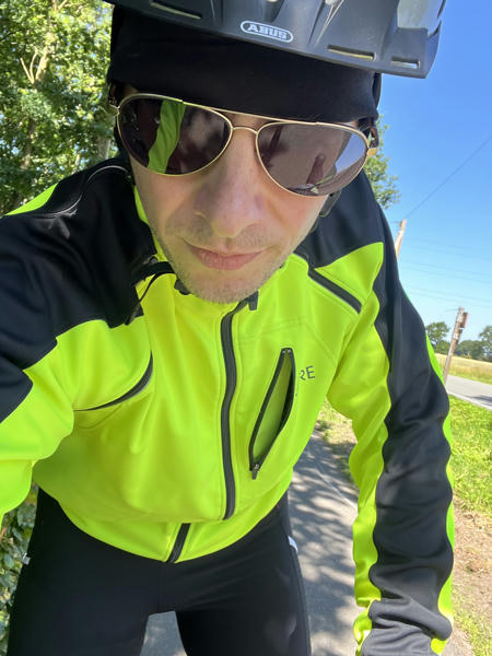 Me on a bike, helmet and sun glasses
